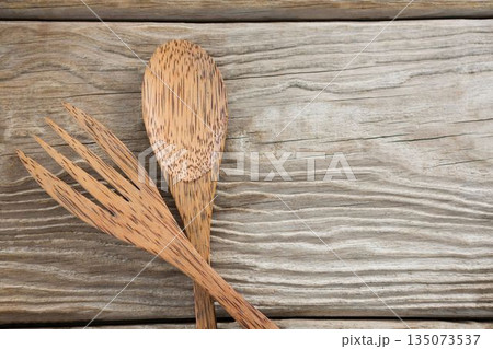 Wooden spoon and fork on table 135073537