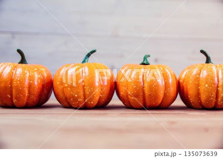 Pumpkins on table during Thanksgiving time Pumpkins on table during Thanksgiving time 135073639