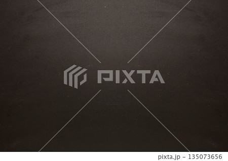 Dark textured surface is covering full width in flat design, showing subtle speckled pattern 135073656