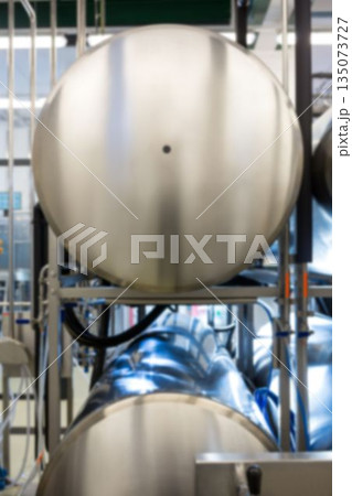 Mettalic cylinders at distillery Mettalic cylinders at distillery 135073727