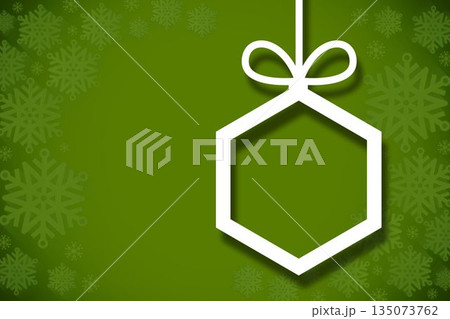 Hanging christmas decorations on green Hanging christmas decorations on green 135073762