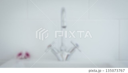 Faucet in kitchen at home Faucet in kitchen at home 135073767