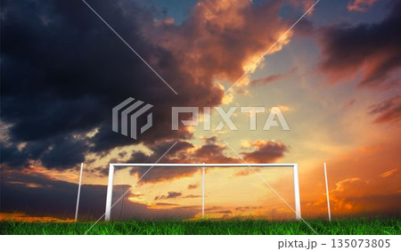 Football goal under orange cloudy sky Football goal under orange cloudy sky 135073805