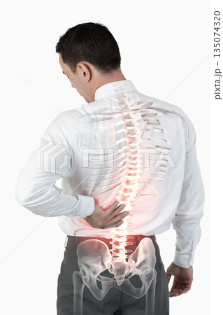 Highlighted spine of man with back pain Highlighted spine of man with back pain 135074320