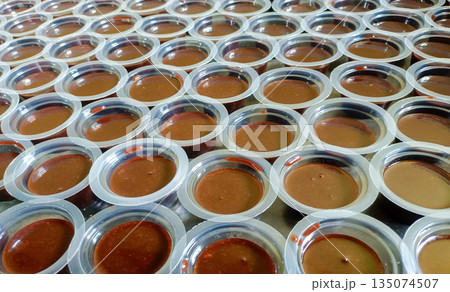 Array Of Traditional Indonesian Chocolate Agar Agar Cups In Natural Lighting 135074507