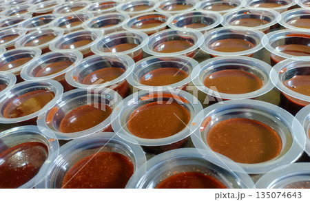 Close Up of Chocolate Agar-Agar Pudding in Small Cups Traditional Indonesian Snack Selective Focus 135074643