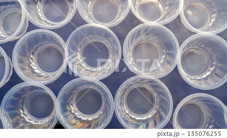 Transparent Plastic Containers Top View Pattern, Empty Disposable Bowls for Food Industry and Event Planning Transparent Plastic Containers Top View Pattern, Empty Disposable Bowls for Food Industry and Event Planning 135076255