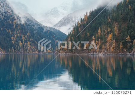 Scenery Jiuzhaigou national park in Sichuan, China. Beautiful Long lake and snow mountain in Autumn season. Famous Landmark and Vacation near Chengdu, China. Asia travel concept Scenery Jiuzhaigou national park in Sichuan, China. Beautiful Long lake and snow mountain in Autumn season. Famous Landmark and Vacation near Chengdu, China. Asia travel concept 135076271