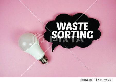 Waste Sorting text with light bulb on pink background 135076531