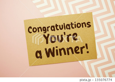 Congratulations You're a Winner! text written on pink background Congratulations You're a Winner! text written on pink background 135076774