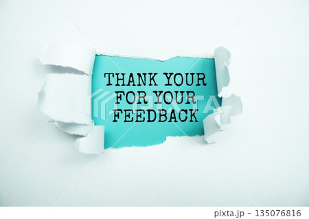 Thank you for your Feedback message written on blue paper with torn paper background 135076816