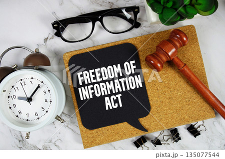 Freedom of Information Act (FOIA) text on speech bubble with alarm clock and wooden gavel on marble background Freedom of Information Act (FOIA) text on speech bubble with alarm clock and wooden gavel on marble background 135077544