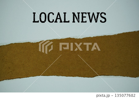 Local News text on paper craft with white paper torn ripped of horizontal 135077682