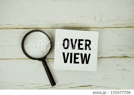 Over View text with magnifying glass on wooden background Over View text with magnifying glass on wooden background 135077706