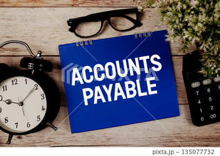 AP Accounts Payable text with alarm clock and calculator on wooden background AP Accounts Payable text with alarm clock and calculator on wooden background 135077732