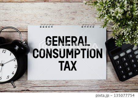 GCT General Consumption Tax text with alarm clock and calculator on wooden background GCT General Consumption Tax text with alarm clock and calculator on wooden background 135077754
