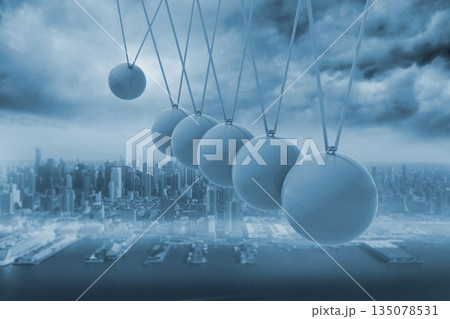 Newtons cradle above city 135078531