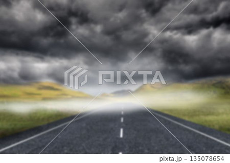 Road by field against stormy clouds Road by field against stormy clouds 135078654