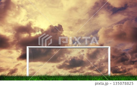 Football goal under cloudy sky Football goal under cloudy sky 135078825