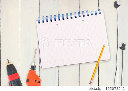 Tools and tablet on wooden background 135078942