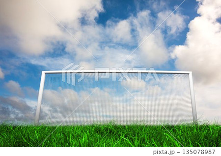 Football goal under blue cloudy sky Football goal under blue cloudy sky 135078987