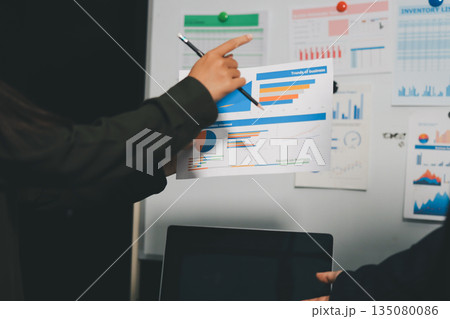 business people in meeting discussing plans together 135080086