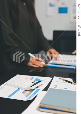 business people in meeting discussing plans together 135080089