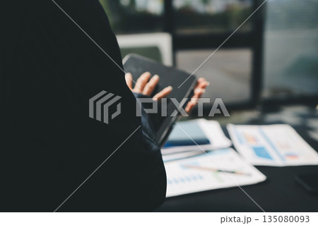 business people in meeting discussing plans together 135080093