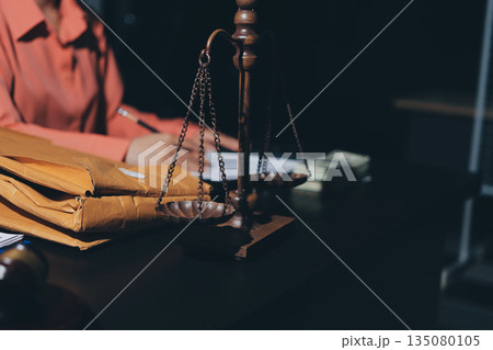 Consultation and conference of professional businesswoman and Male lawyers working and discussion having at law firm in office. Concepts of law, Judge gavel with scales of justice Consultation and conference of professional businesswoman and Male lawyers working and discussion having at law firm in office. Concepts of law, Judge gavel with scales of justice 135080105