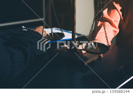 Consultation and conference of professional businesswoman and Male lawyers working and discussion having at law firm in office. Concepts of law, Judge gavel with scales of justice Consultation and conference of professional businesswoman and Male lawyers working and discussion having at law firm in office. Concepts of law, Judge gavel with scales of justice 135080144