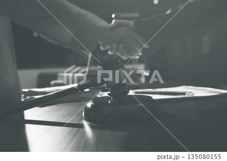 Consultation and conference of professional businesswoman and Male lawyers working and discussion having at law firm in office. Concepts of law, Judge gavel with scales of justice Consultation and conference of professional businesswoman and Male lawyers working and discussion having at law firm in office. Concepts of law, Judge gavel with scales of justice 135080155