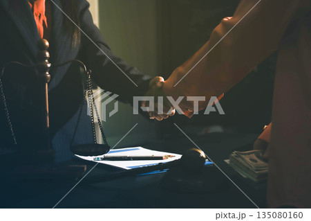 Consultation and conference of professional businesswoman and Male lawyers working and discussion having at law firm in office. Concepts of law, Judge gavel with scales of justice 135080160
