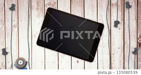 Tablet pc on wooden surface 135080539