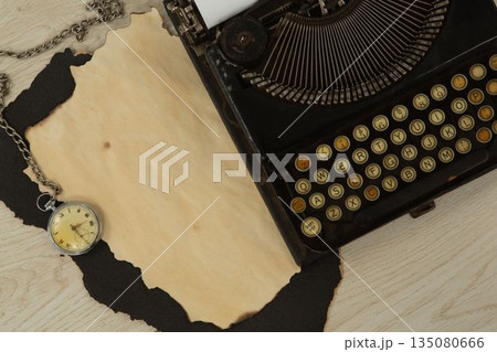Paper piece, typewriter and clock on table 135080666