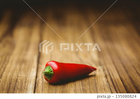 Red hot pepper on wooden table Red hot pepper on wooden table 135080824