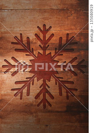 Rustic flat design is showing reddish brown snowflake motif on weathered wooden planks with knots Rustic flat design is showing reddish brown snowflake motif on weathered wooden planks with knots 135080919