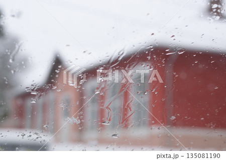 Raindrops on the window glass, Icy flowers - frozen window 135081190