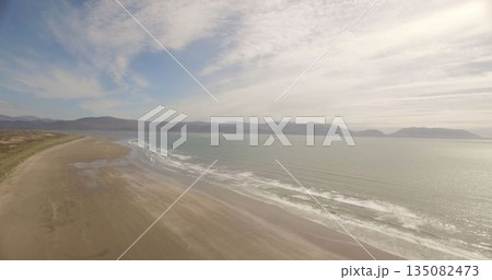 Sea coastline against cloudy sky 135082473