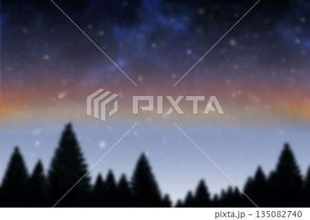 Coniferous forest silhouette spanning width under gradient night sky revealing stars and Milky Way Coniferous forest silhouette spanning width under gradient night sky revealing stars and Milky Way 135082740
