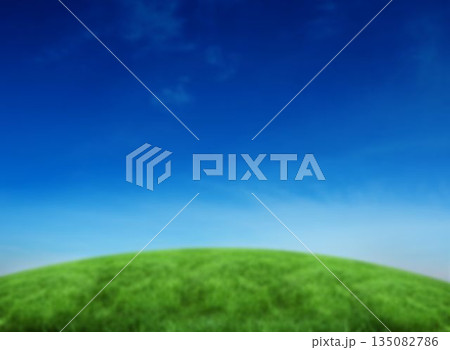 Grassy hill against blue sky Grassy hill against blue sky 135082786