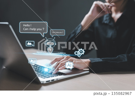 Businesswoman using laptop with AI chatbot interface virtual assistant icons, representing artificial intelligence, automation and digital customer support technology. 135082967