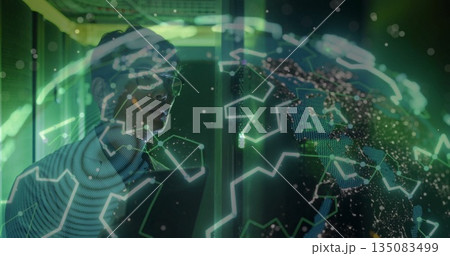 Studying holographic globe, Korean man in sweater operating in lab, with particles, copy space Studying holographic globe, Korean man in sweater operating in lab, with particles, copy space 135083499