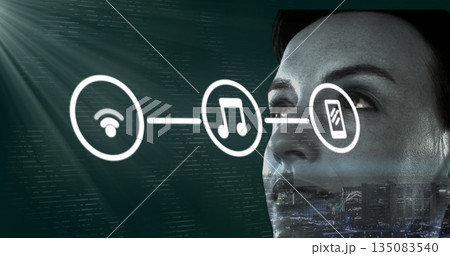 Face being overlaid with Wi-Fi, music and smartphone icons, code and city-skyline on screen, cop Face being overlaid with Wi-Fi, music and smartphone icons, code and city-skyline on screen, cop 135083540