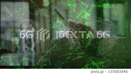 Professional using tablet in office with holographic world map, 6G network and monitors, copy space Professional using tablet in office with holographic world map, 6G network and monitors, copy space 135083840