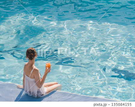 Cute woman with a glass of drink 135084155
