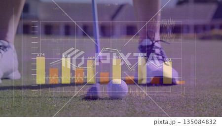 Aligning golfer lining up golf ball on tee on green, with bar charts and line graphs 135084832