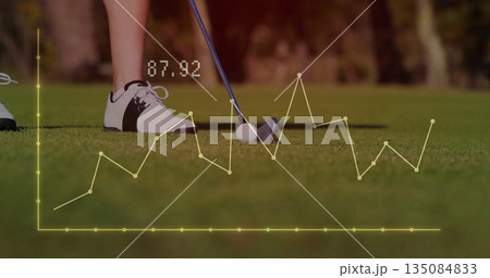 Golfer's lower legs aligning iron club on putting green, with ball, analytics overlay showing 87 135084833