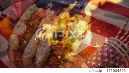 Displaying 3 flaming tacos with meat, peppers, sauce on wood board, American flag overlay and picks 135084895