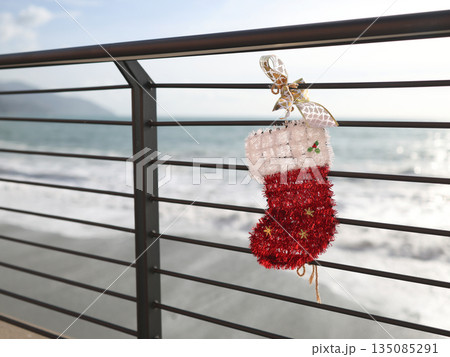 Christmas stocking on seafront promenade in old town of Monterosso, Cinque Terre, Italy. Nature, holidays and winter. Tourism and recreation in Liguria.  135085291