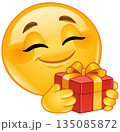 Emoticon Holding a Gift 135085872